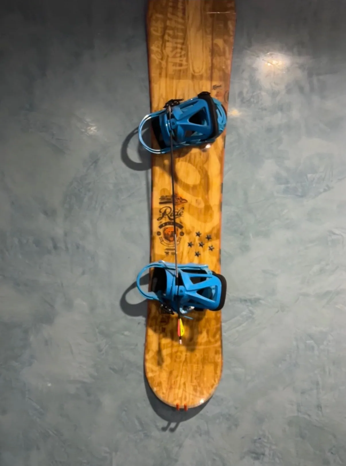 Pale ice-blue Grassello feature wall with a snowboard mounted on it