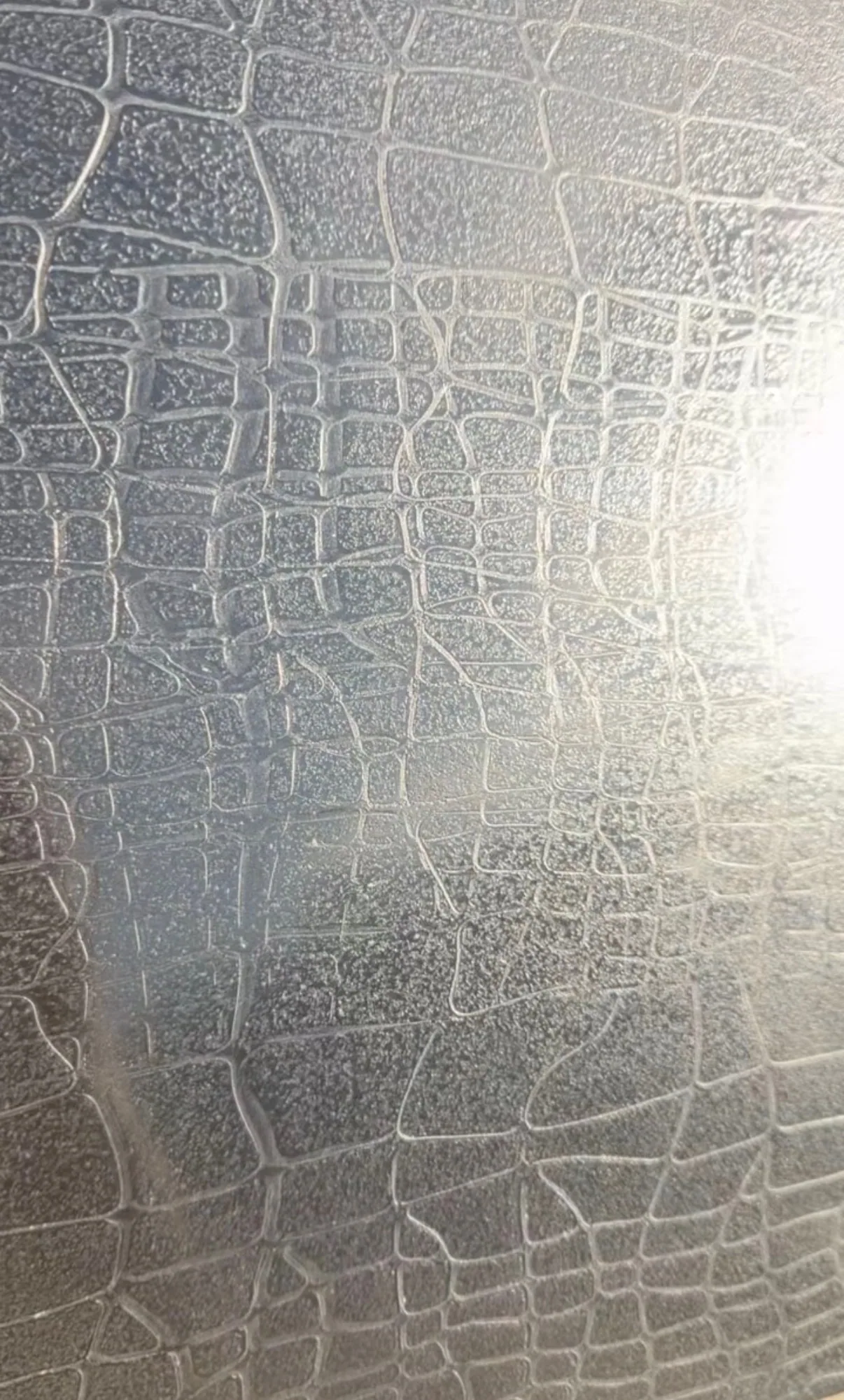 Warm-toned crocodile-skin textured plaster panel
